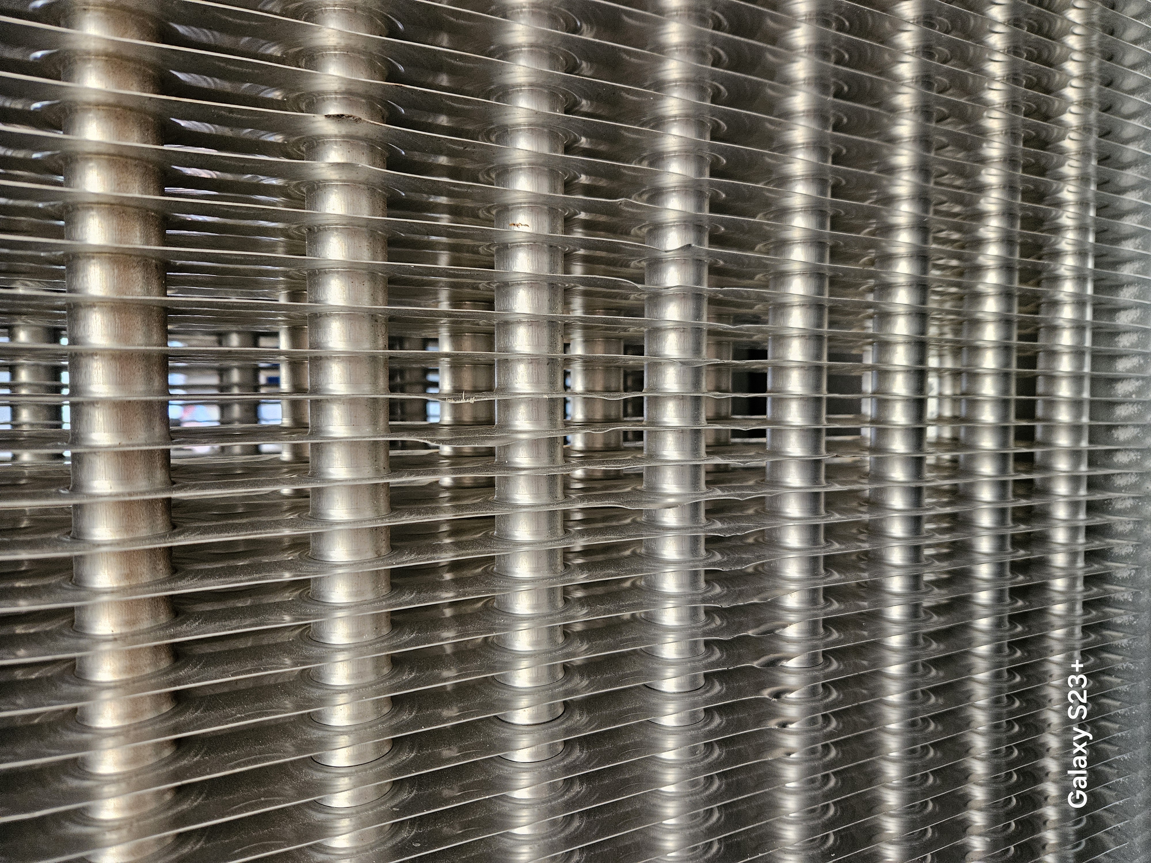 Restored industrial coil fin pack after repair work