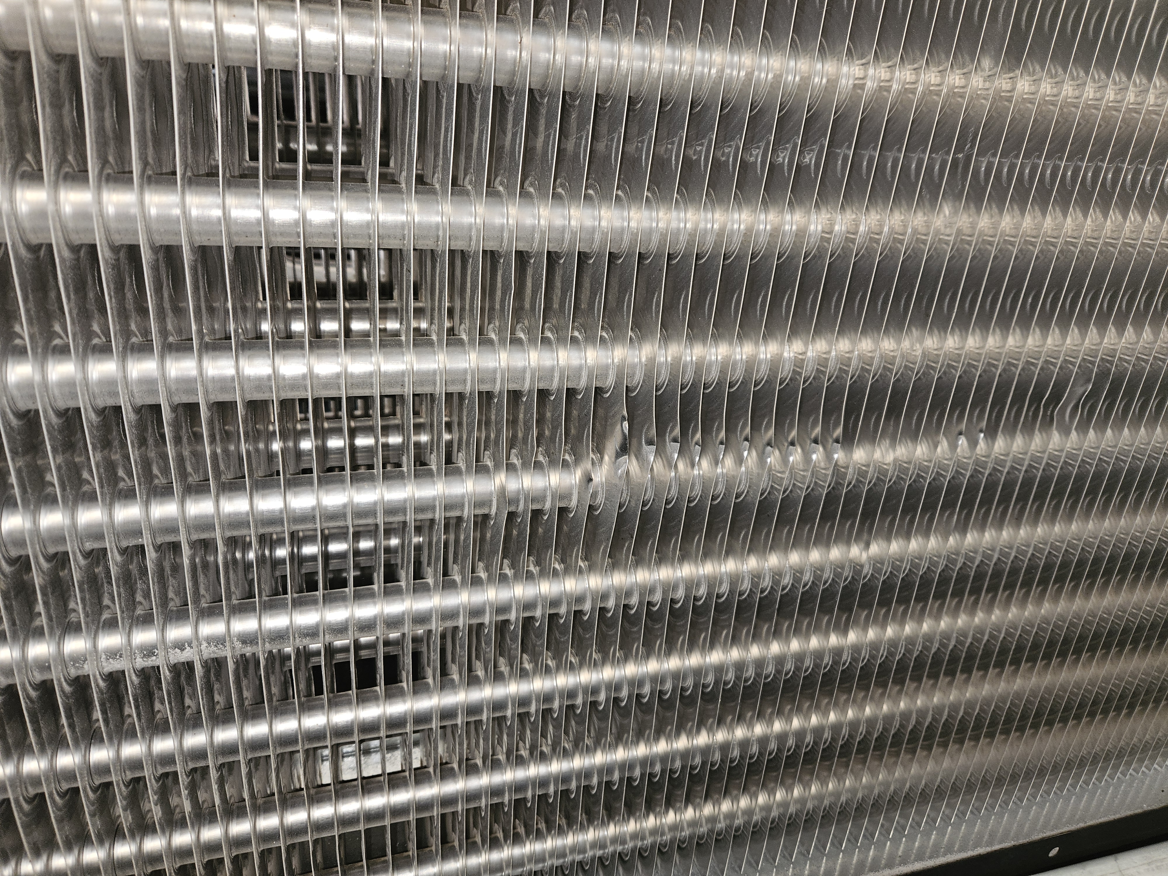 Localised access created through an industrial coil fin pack