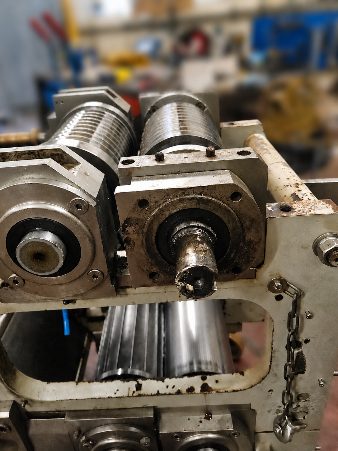 Damaged industrial machine shaft within its surrounding mechanical assembly