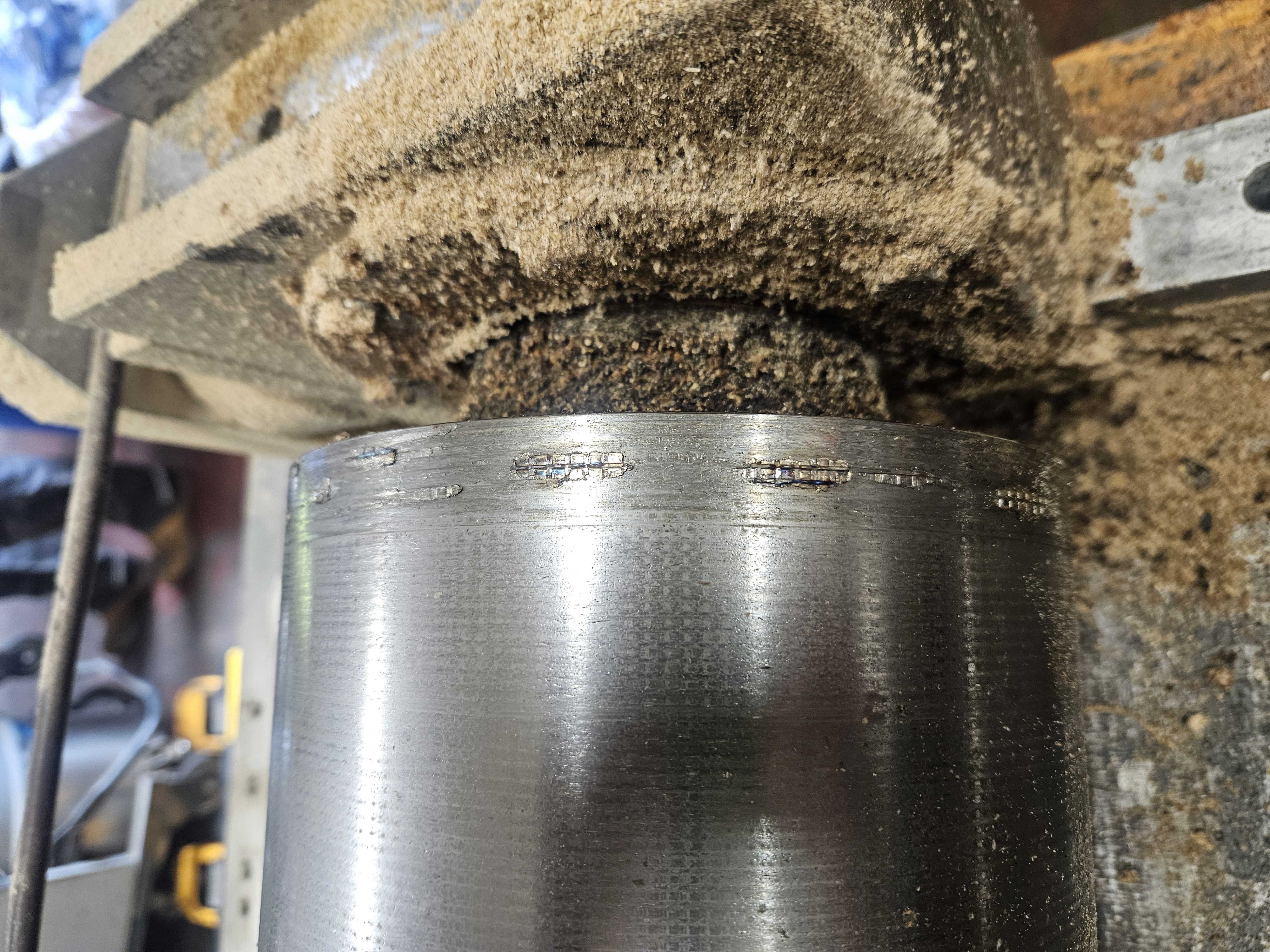 Scored and worn shaft or roller running surface