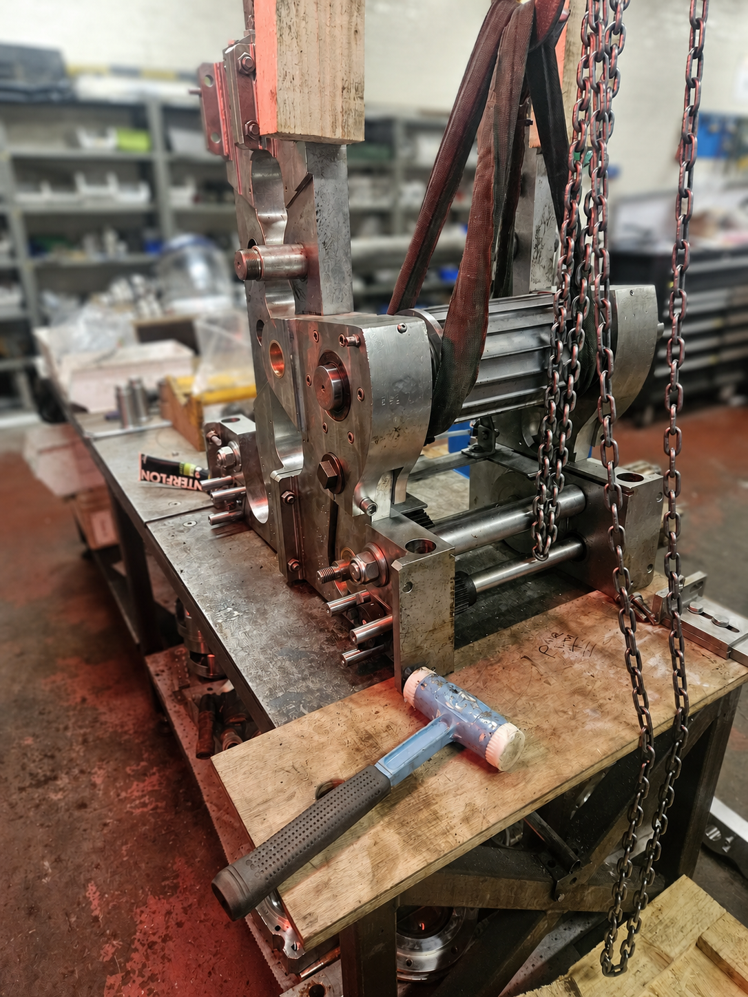 Industrial machinery undergoing controlled workshop strip-down